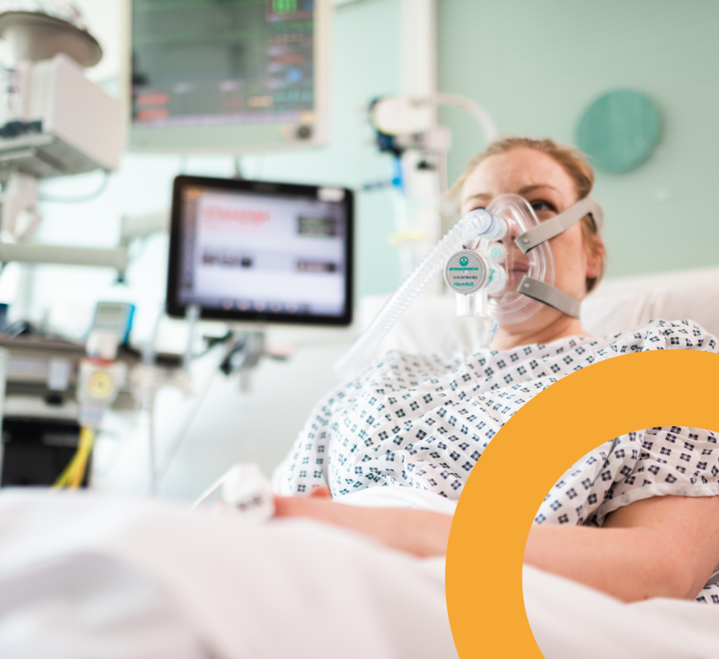 Woman in hospital using CPAP breathing aid